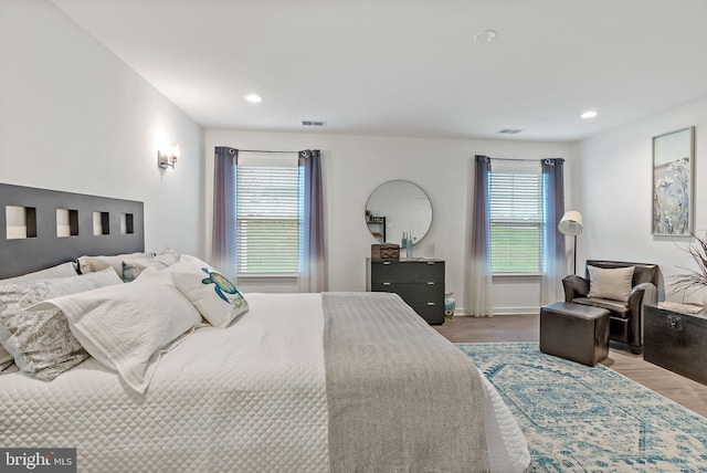 bedroom with hardwood / wood-style flooring