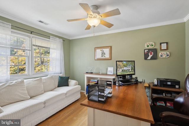 office with ceiling fan, ornamental molding, and light wood-type flooring