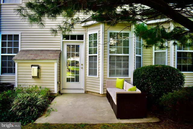 entrance to property featuring a patio