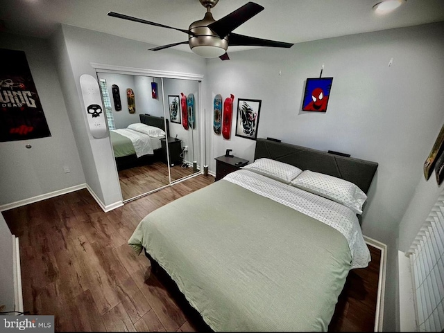 bedroom with a closet, ceiling fan, and hardwood / wood-style flooring