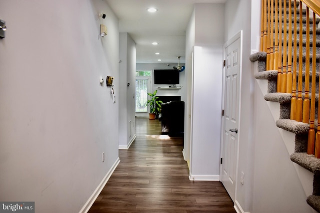 hallway featuring dark wood-type flooring