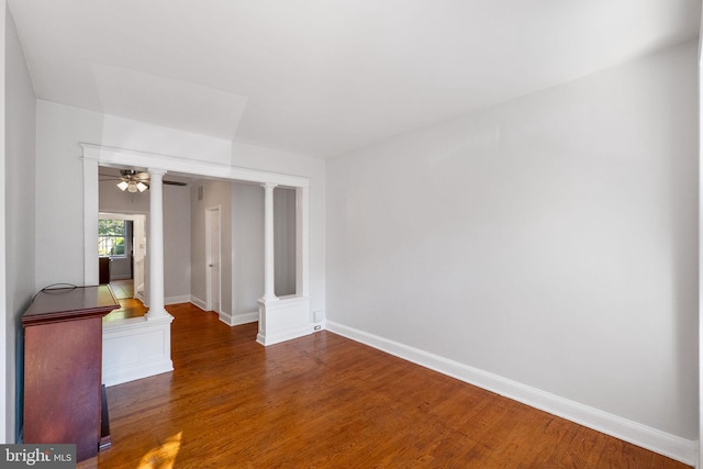 unfurnished room featuring dark hardwood / wood-style flooring