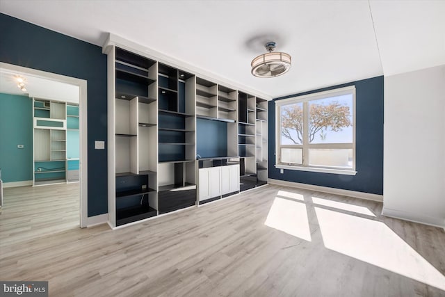 unfurnished living room featuring wood-type flooring