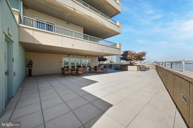 view of patio featuring a water view