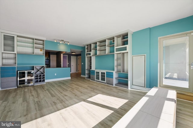 unfurnished living room featuring wood-type flooring