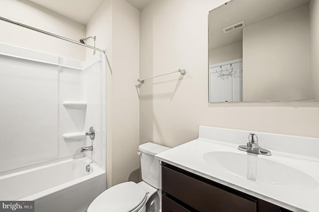 full bathroom featuring shower / bathing tub combination, vanity, and toilet