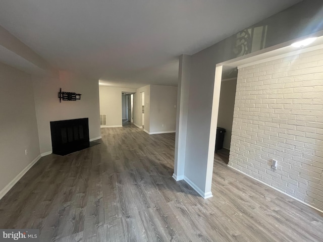 unfurnished living room with hardwood / wood-style flooring