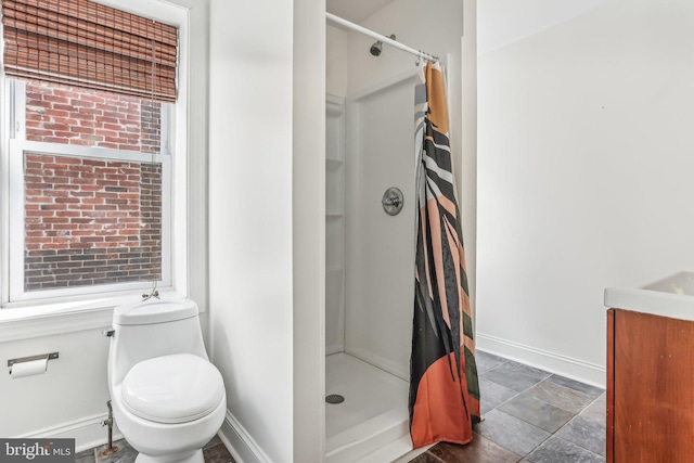 bathroom featuring vanity, toilet, and a shower with curtain