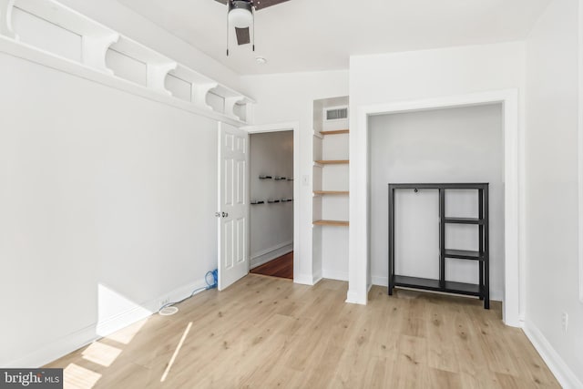 interior space with light wood-type flooring and ceiling fan