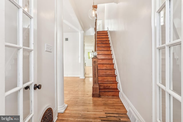 interior space featuring wood-type flooring and vaulted ceiling