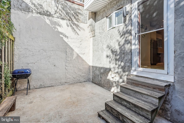 view of patio with a grill