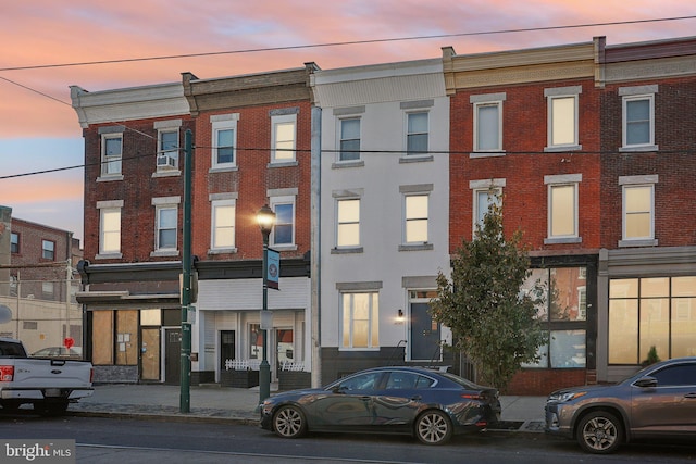 view of outdoor building at dusk