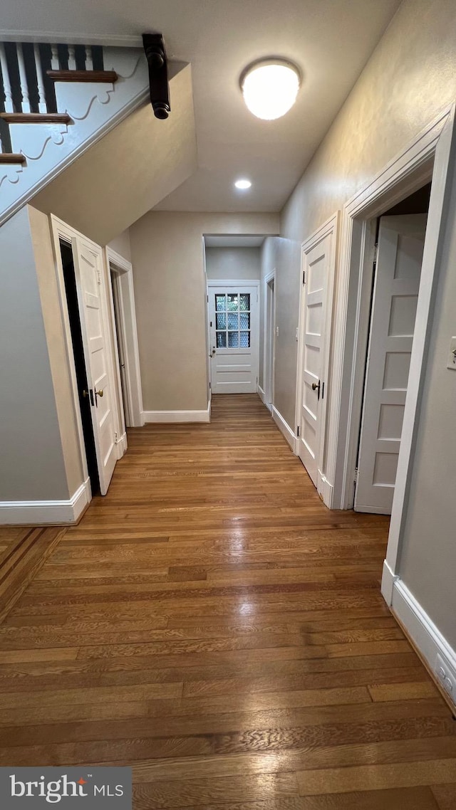 hallway featuring hardwood / wood-style flooring