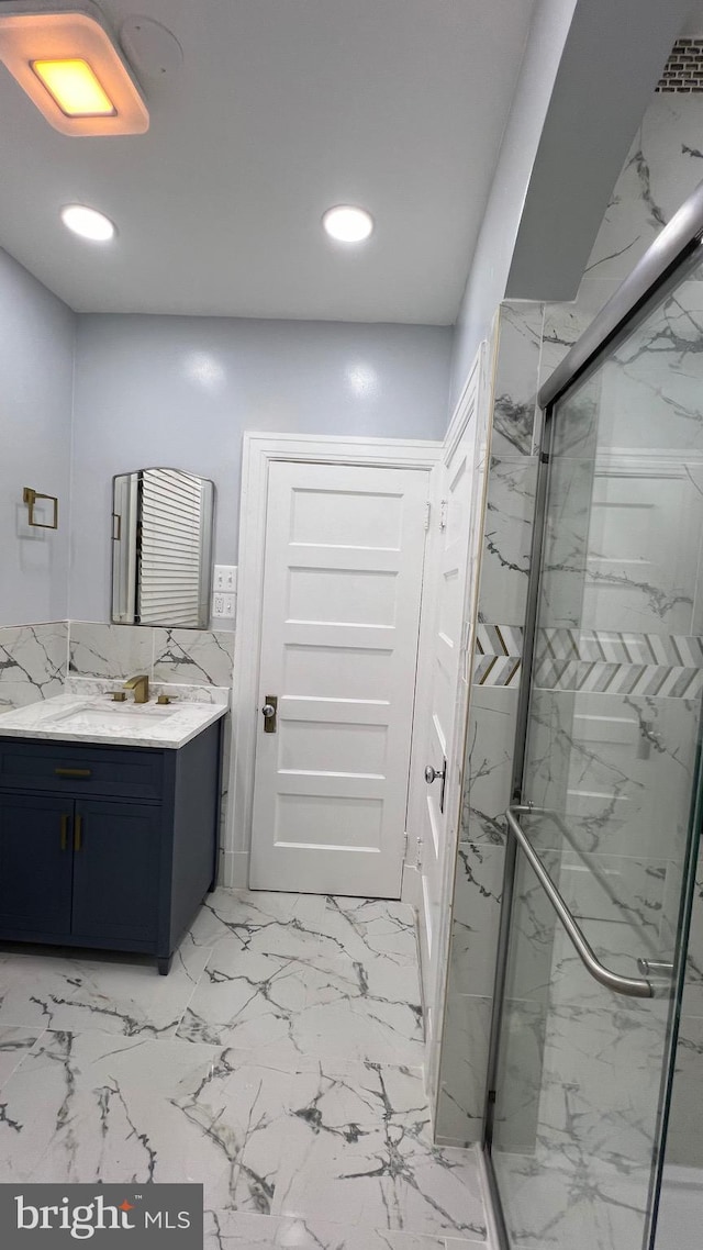 bathroom with vanity and walk in shower