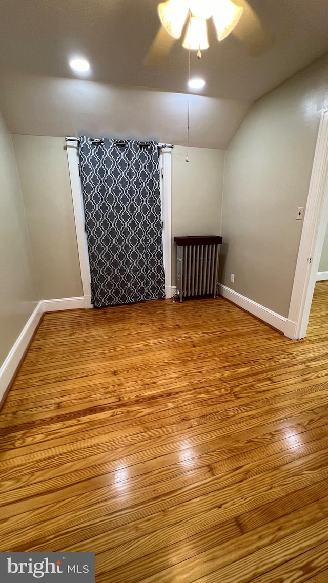 bonus room featuring lofted ceiling, light wood-type flooring, and ceiling fan