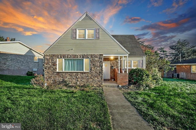 view of front of home with a lawn