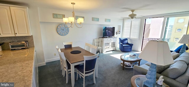 1 Virginia Ave Unit 501, Rehoboth Beach, DE 19971 - dining room with dark colored carpet, a chandelier, and ceiling fan