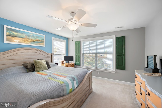 carpeted bedroom with ceiling fan