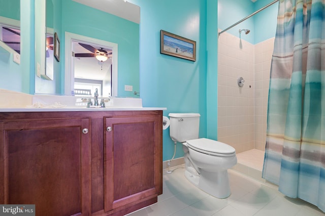 bathroom with tile patterned floors, a shower with curtain, vanity, ceiling fan, and toilet