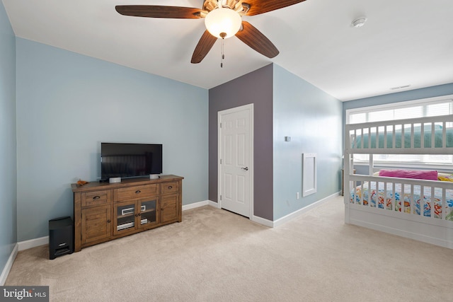 carpeted bedroom with ceiling fan