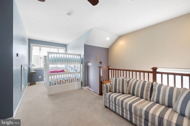 bedroom featuring light carpet, ceiling fan, and vaulted ceiling