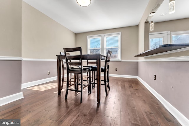 dining area featuring dark hardwood / wood-style floors