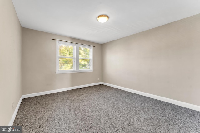 unfurnished room featuring carpet floors