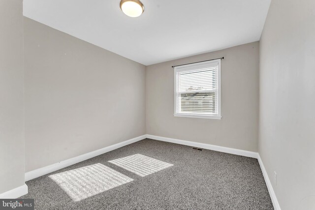 spare room with carpet floors