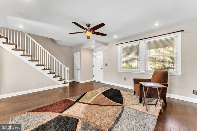 foyer entrance with ceiling fan and dark hardwood / wood-style flooring