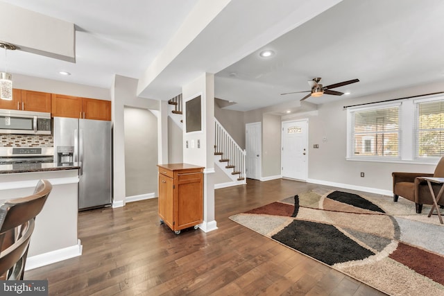 entrance foyer with ceiling fan and dark hardwood / wood-style flooring