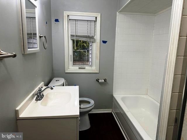 full bathroom featuring vanity, toilet, and tub / shower combination