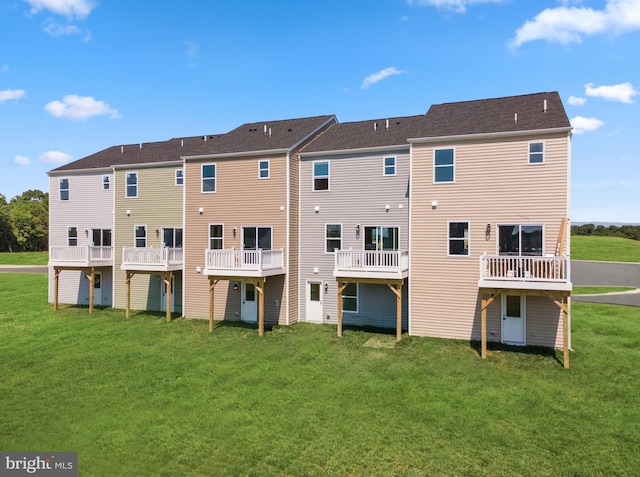 back of property featuring a yard