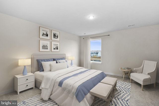 bedroom featuring light colored carpet