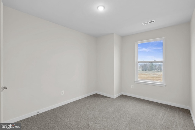 empty room with carpet flooring