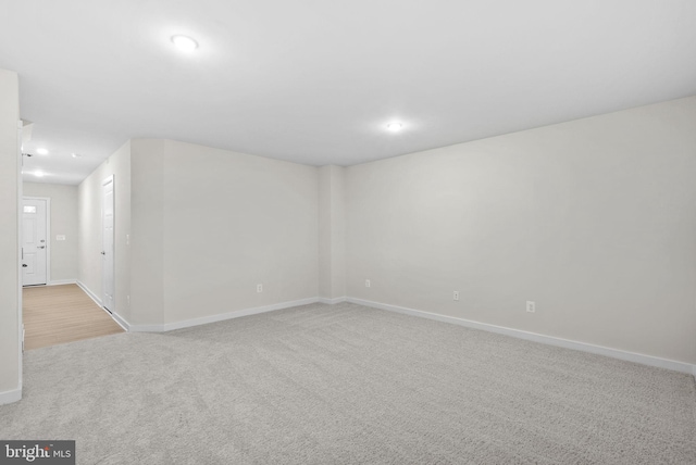 empty room featuring light carpet