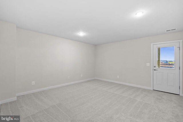 unfurnished room with light carpet