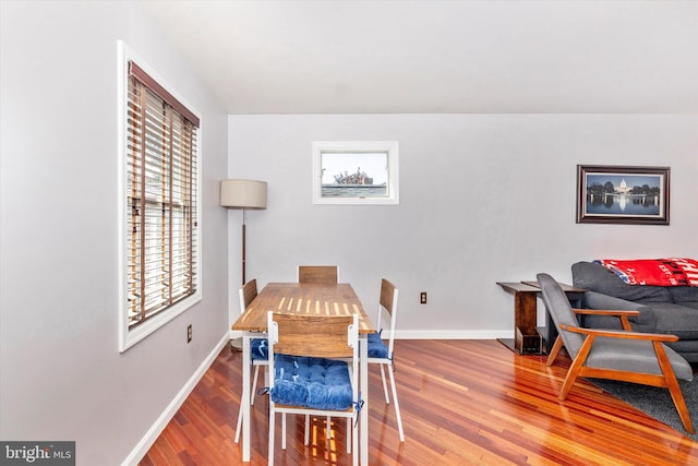 dining space with hardwood / wood-style flooring and plenty of natural light