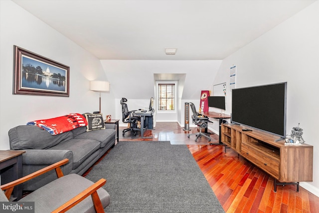 living room featuring hardwood / wood-style floors and vaulted ceiling