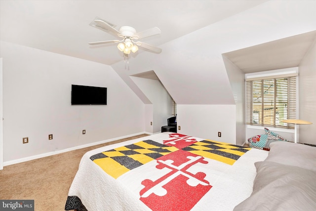 carpeted bedroom with ceiling fan and vaulted ceiling