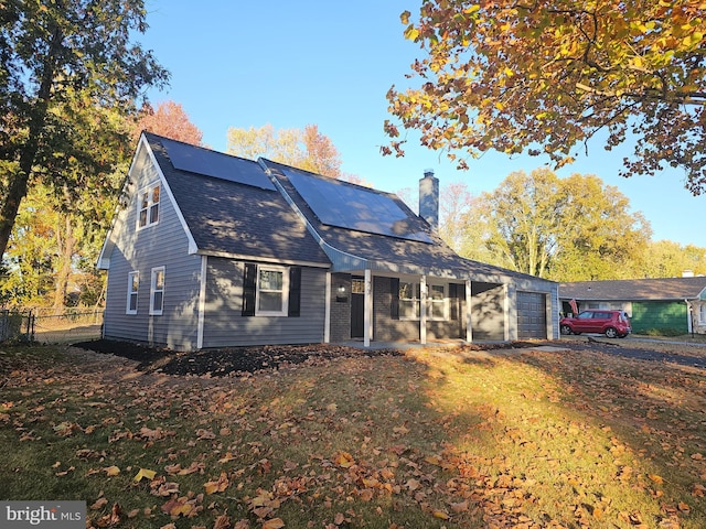 73 Genesee Ln, Willingboro, NJ 08046 - view of front facade with a chimney, covered porch, fence, a shingled roof, and a garage