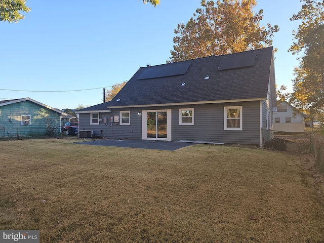 back of property featuring a yard, a patio area, and central AC