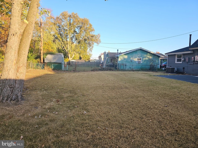 view of yard featuring central air condition unit