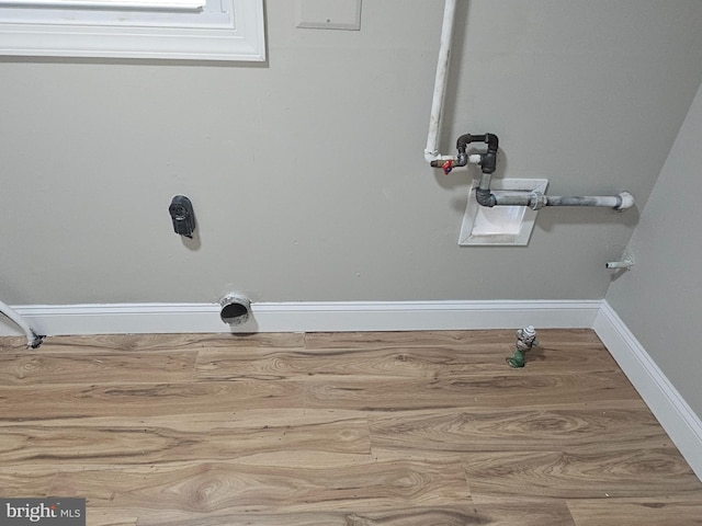 73 Genesee Ln, Willingboro, NJ 08046 - washroom featuring wood finished floors, laundry area, and baseboards