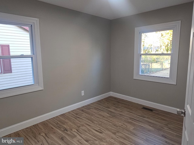 73 Genesee Ln, Willingboro, NJ 08046 - unfurnished room with visible vents, dark wood-style floors, and baseboards
