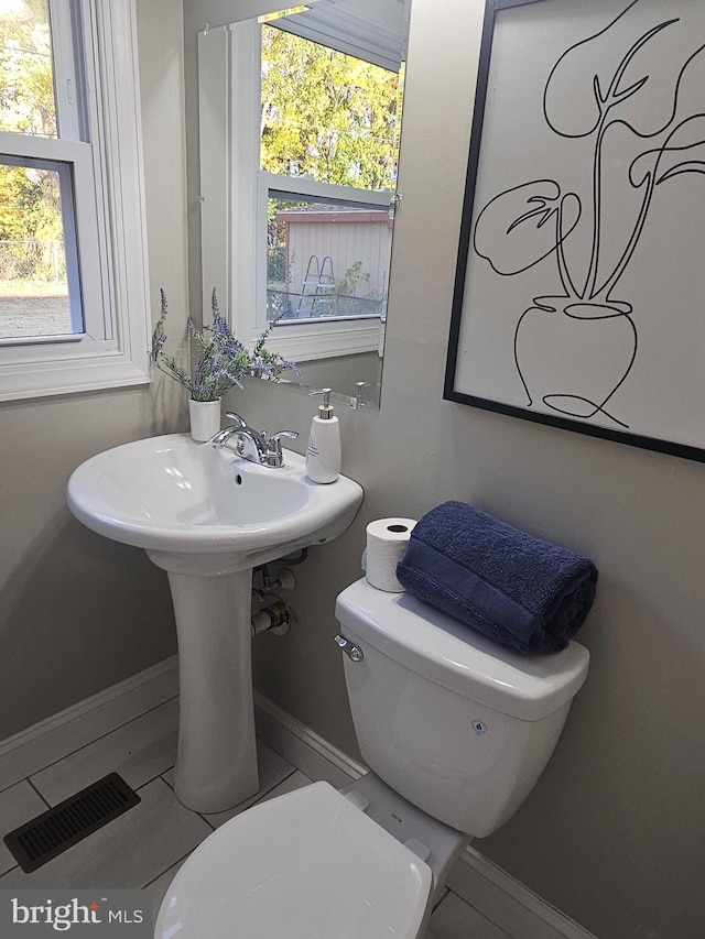 73 Genesee Ln, Willingboro, NJ 08046 - bathroom with a wealth of natural light, visible vents, toilet, and baseboards