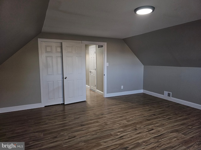 73 Genesee Ln, Willingboro, NJ 08046 - bonus room featuring visible vents, baseboards, lofted ceiling, and dark wood finished floors