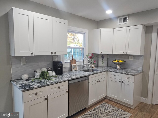 73 Genesee Ln, Willingboro, NJ 08046 - kitchen featuring light wood-style flooring, white cabinets, dishwasher, a sink, and visible vents
