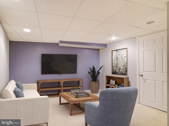 living room featuring a drop ceiling