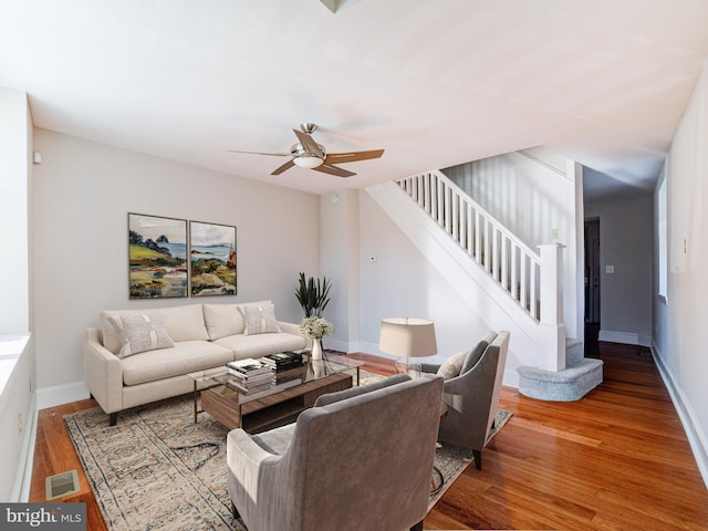 living room with ceiling fan and hardwood / wood-style floors