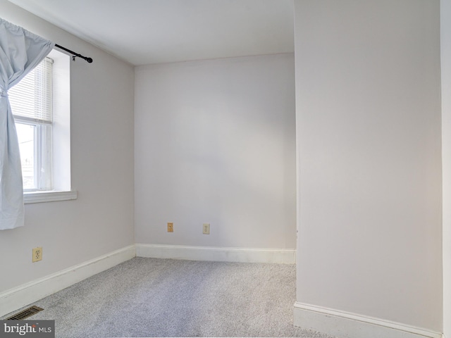 empty room featuring light colored carpet